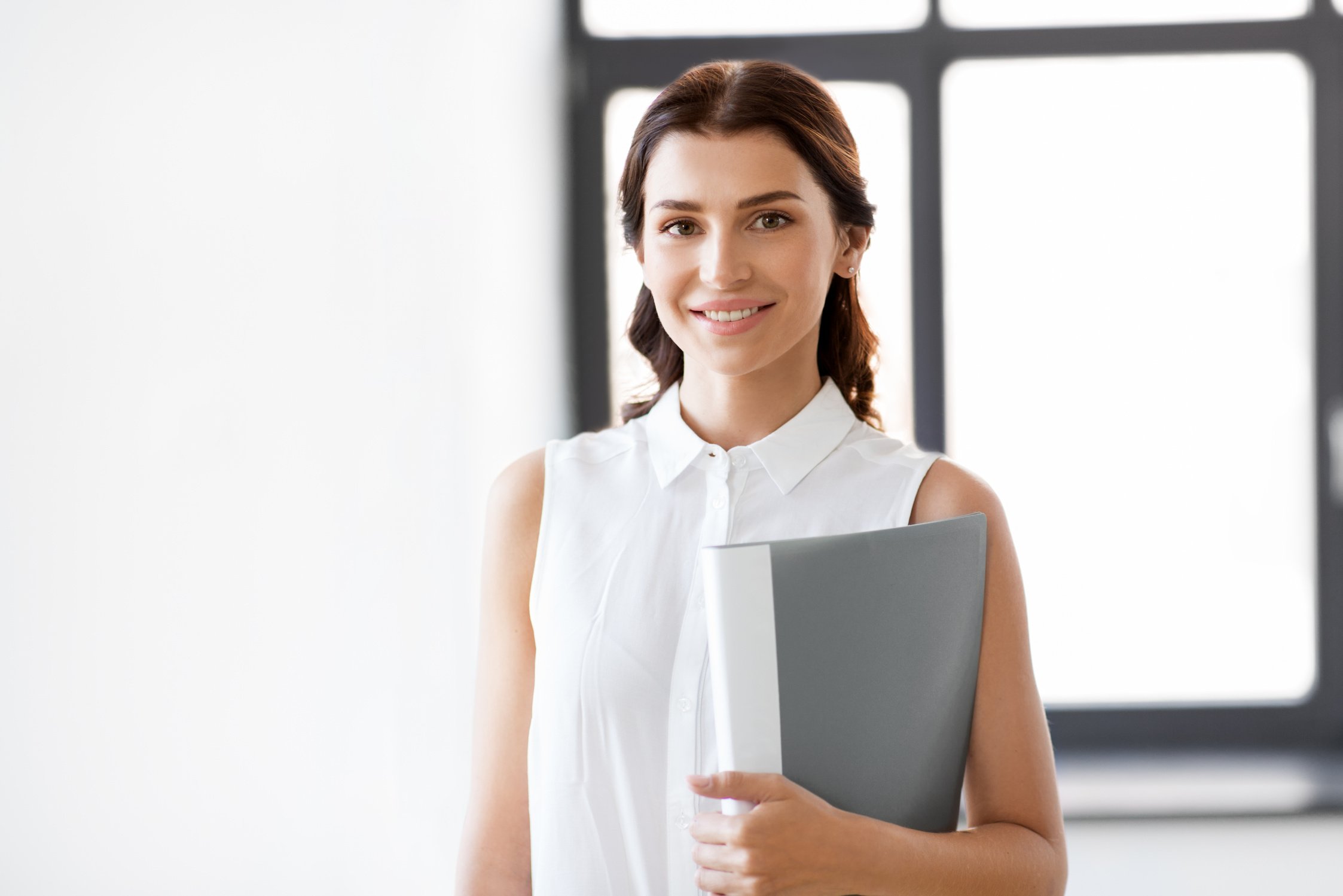 Businesswoman or Realtor with Folder at Office
